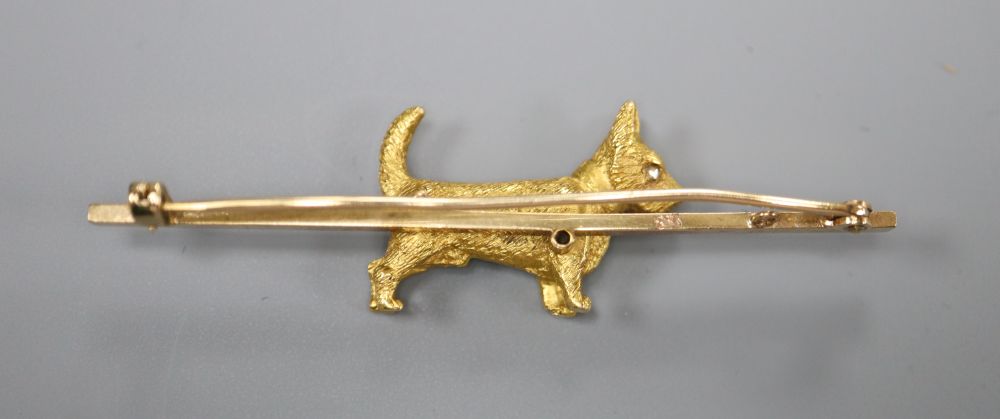 An early 20th century yellow metal, 18ct and rose cut diamond set terrier bar brooch, 63mm, gross 8.7 grams.